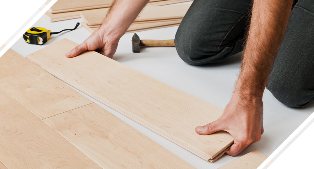 Carpenter installing flooring